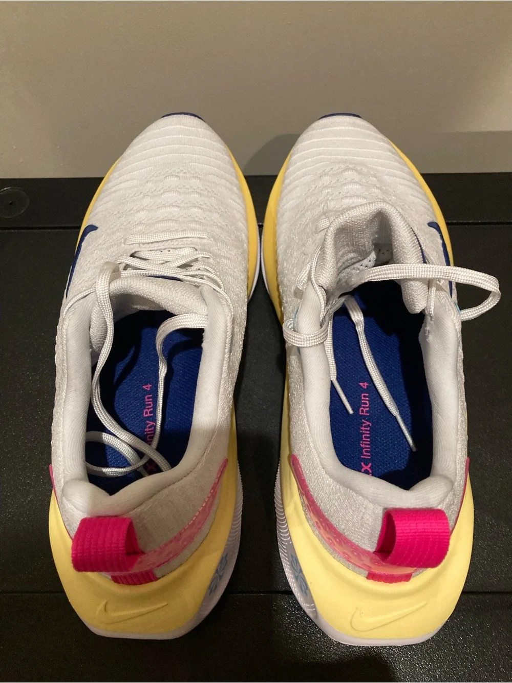 Nike White Athletic Shoes with Blue Swoosh and Yellow Midsole